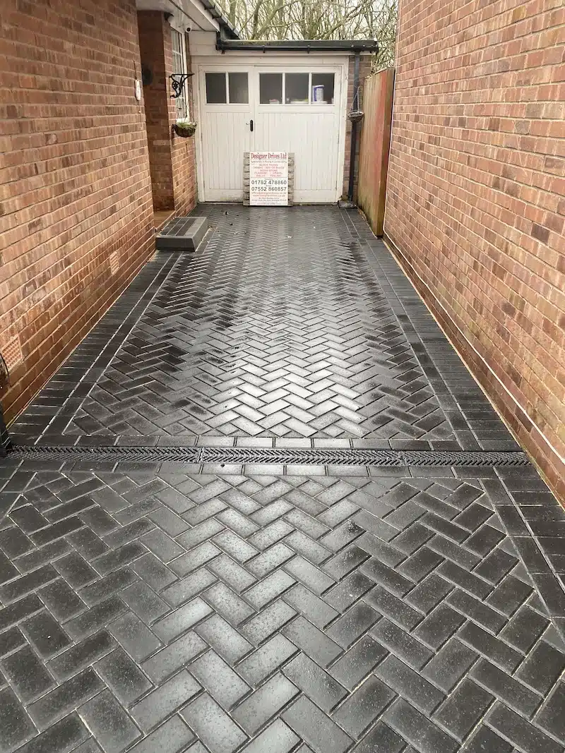 black herringbone block paved driveway