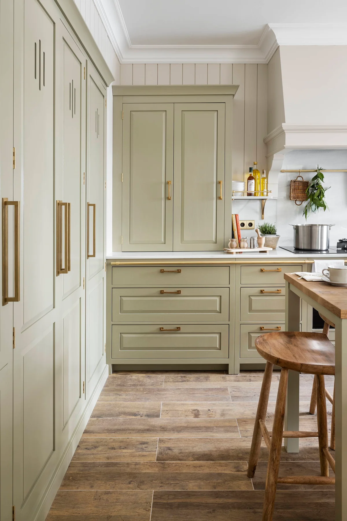 green kitchen with wooden floor