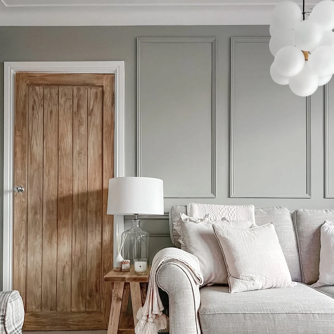 oak cottage style door with traditional wall panelling