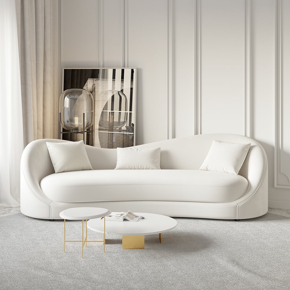 white sofa in white decorated room with wall panelling