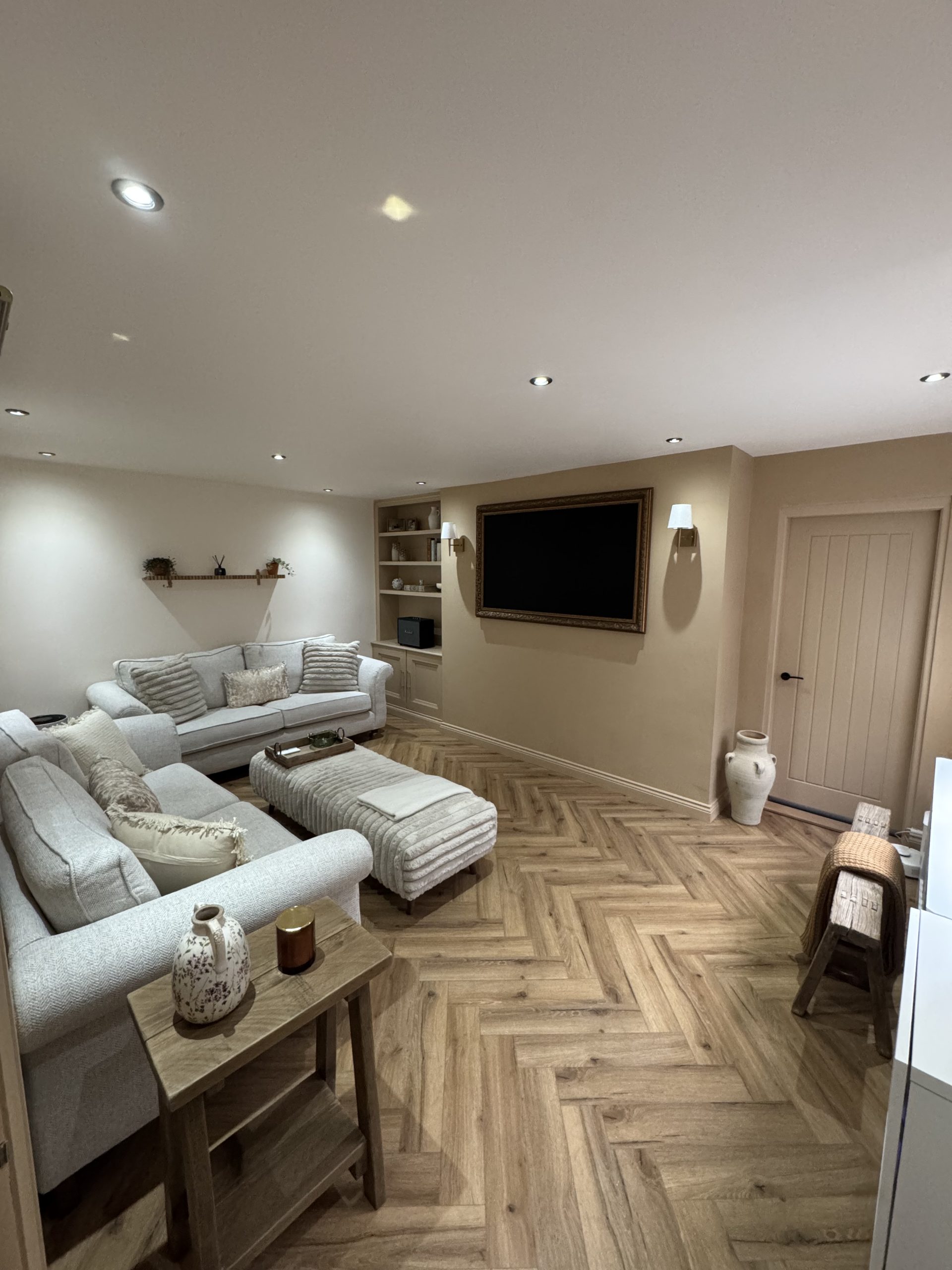 warm living room with oak LVT flooring and mystic mocca walls
