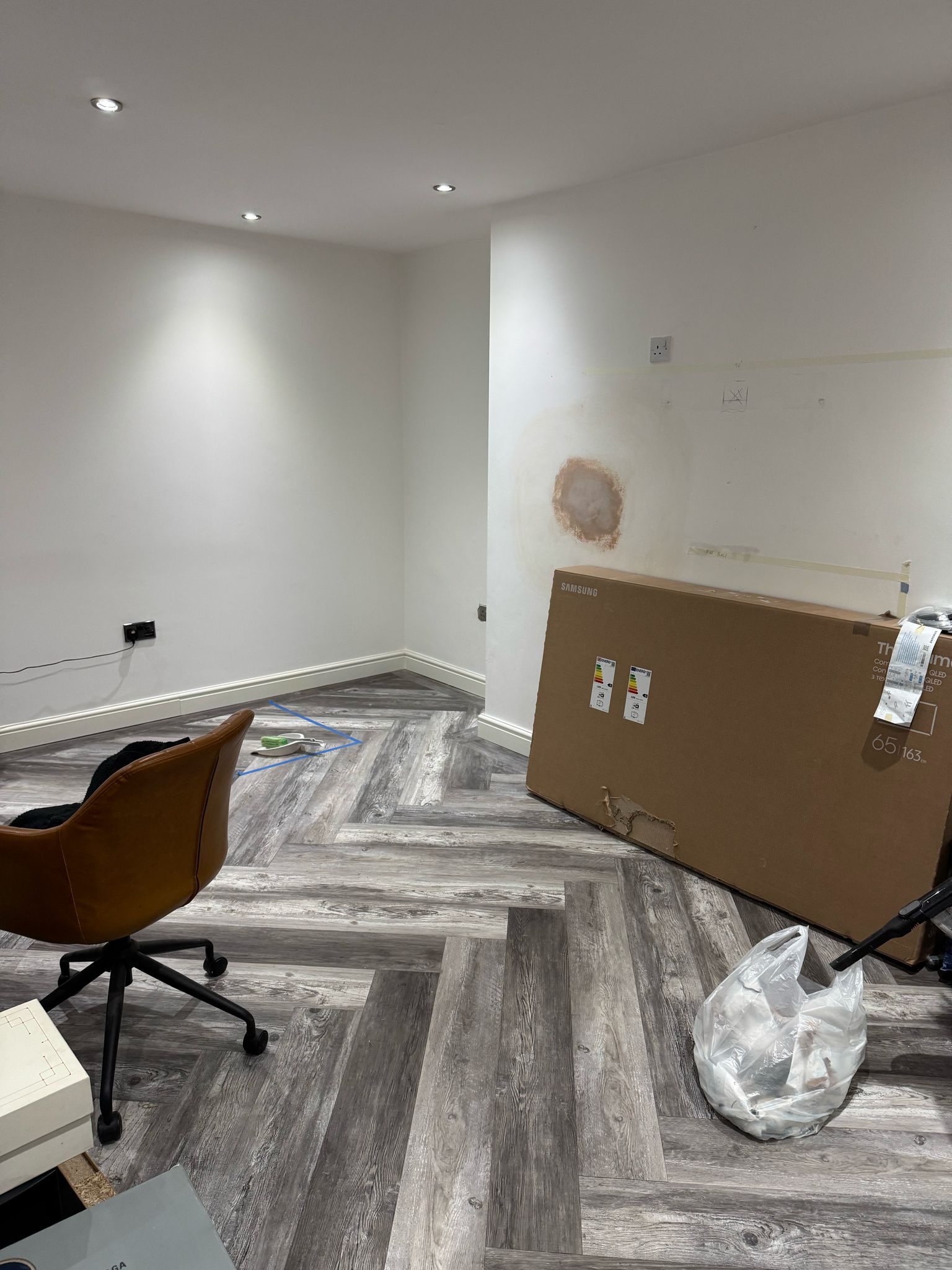 empty room with grey LVT flooring and white walls